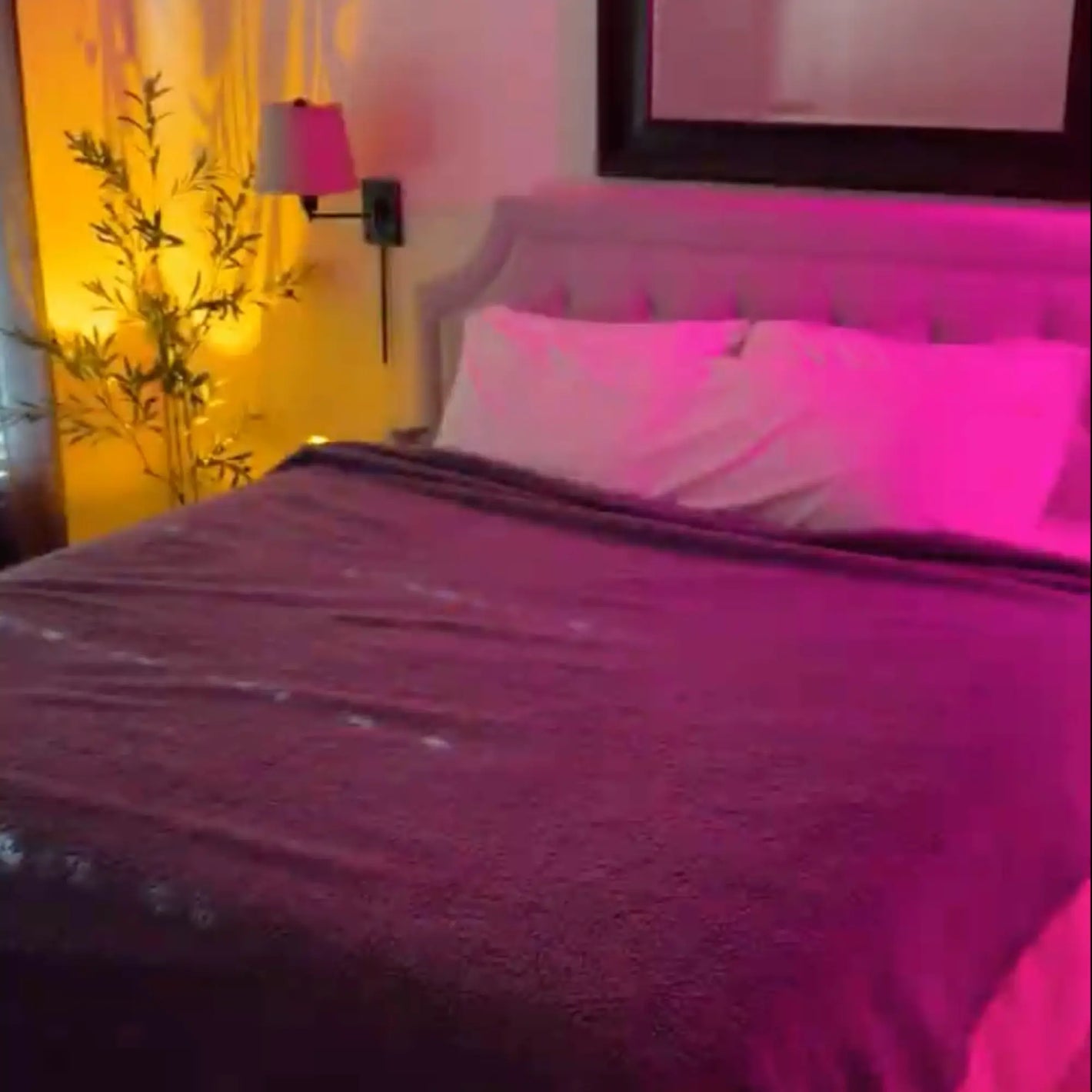 Review with a grey LoveBlanket on a bed